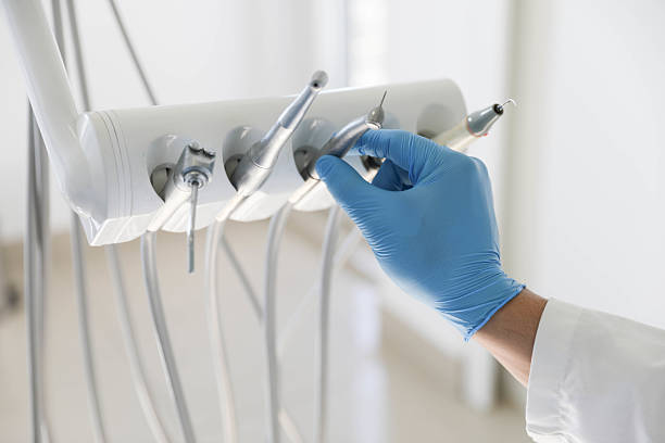 Professional Tooth Extraction technician working in Houston County County, GA